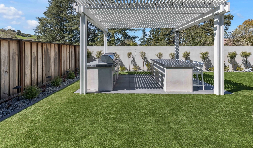 Backyard remodel with outdoor grill area.