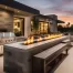 Outdoor kitchen, outdoor fire-pit, and outdoor seating on home patio.