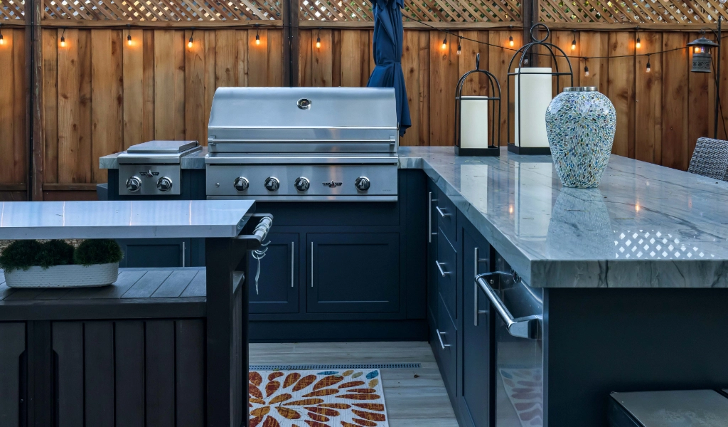 a relaxing and modern backyard living space and outdoor kitchen remodel with outdoor furniture and fireplace