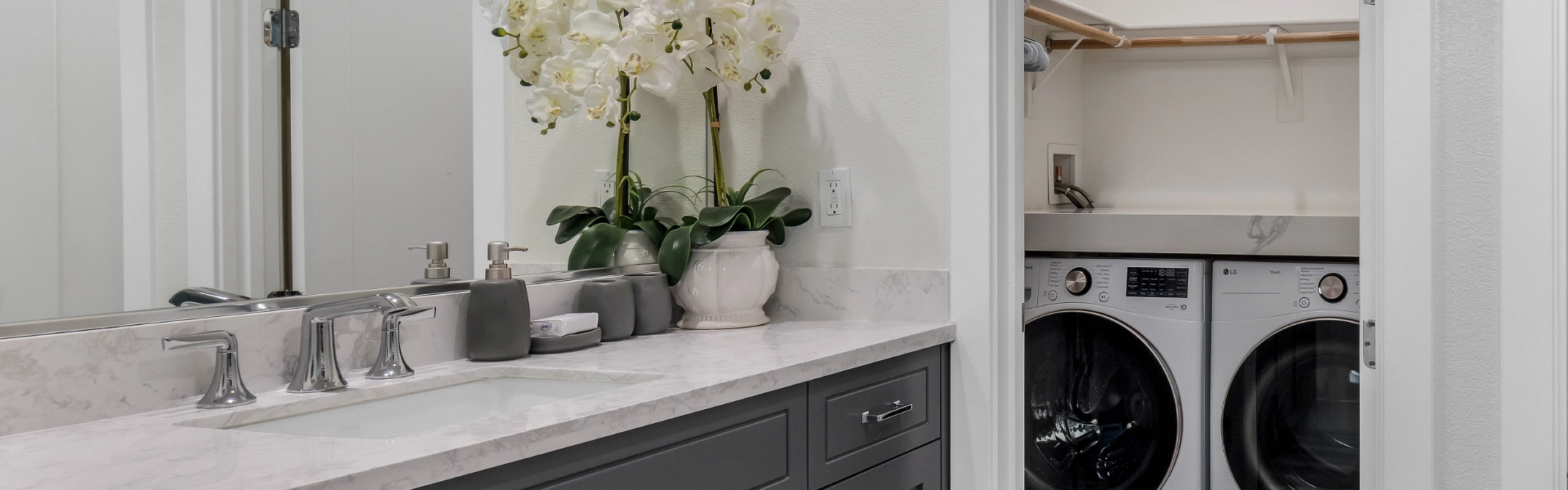 A luxurious home addition with a bathroom and small laundry room.