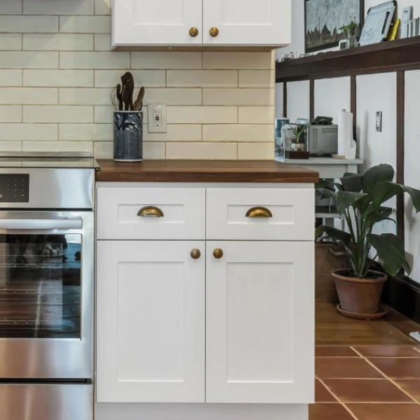 A modern kitchen opening into a living space.