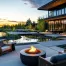 Modern outdoor living space with fire pit surrounded by sleek architecture, tranquil water features, and lush greenery at sunset in a serene setting.